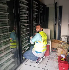 IP Care technician terminating fiber at an optical distribution frame at Paragon Mall