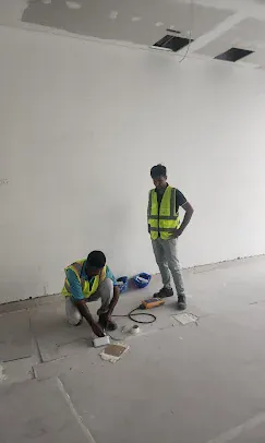 IP Care technicians terminating floor data cabling at Yas Driving Academy